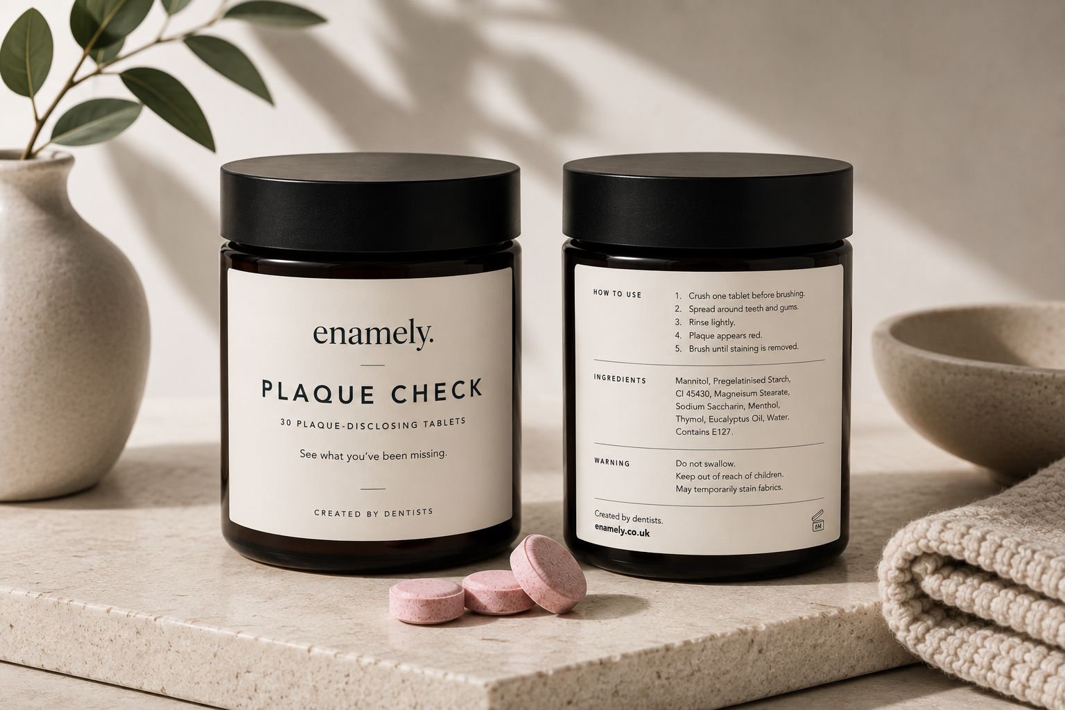 Two jars of Enamely Plaque Check